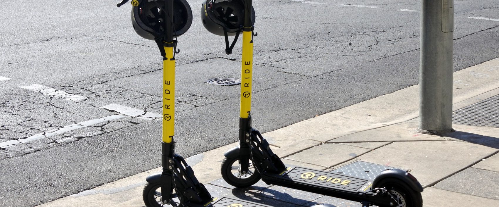 Ride dock-less e-scooters on an Adelaide street