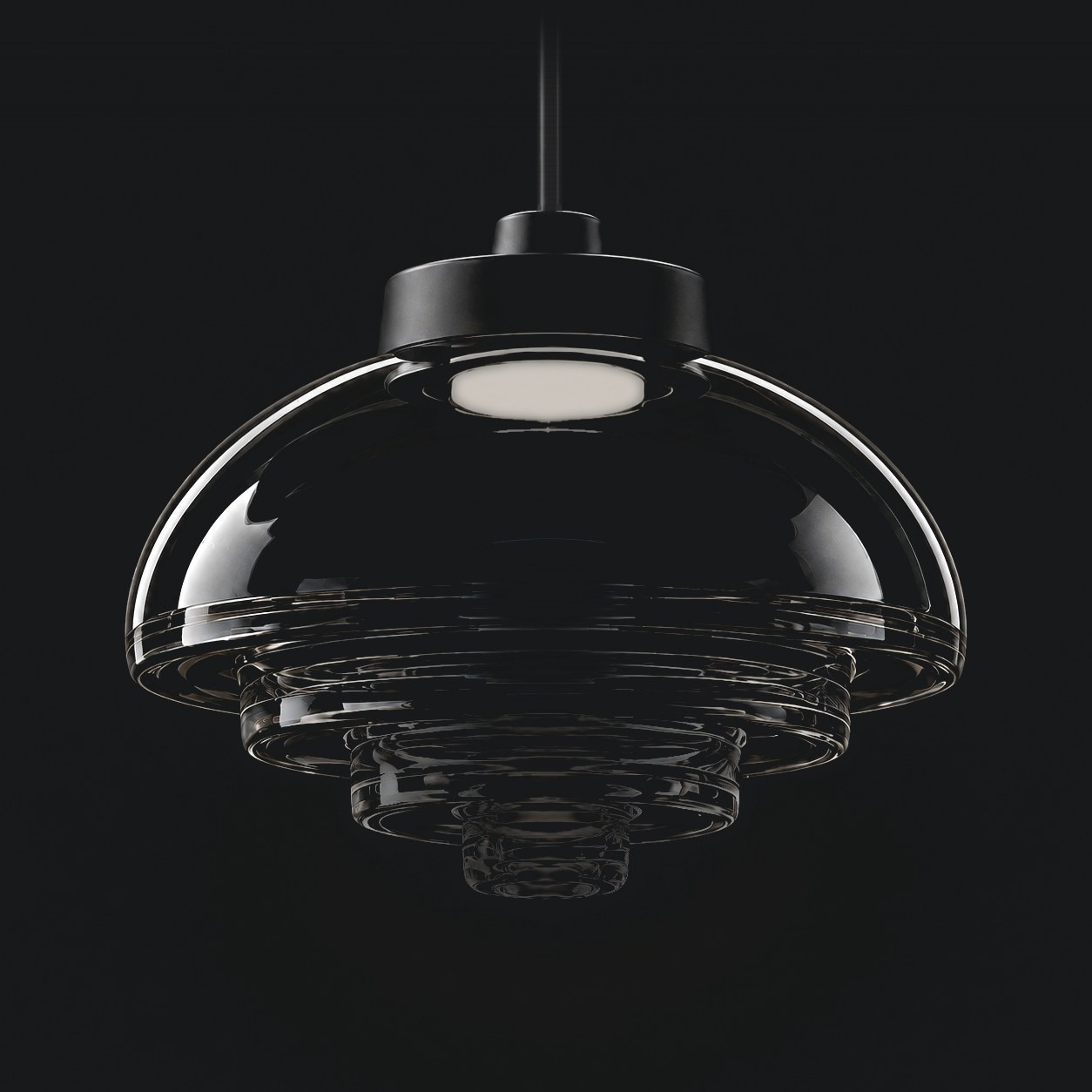 Viro Fresnel pendant with clear stepped glass unlit against a dark background